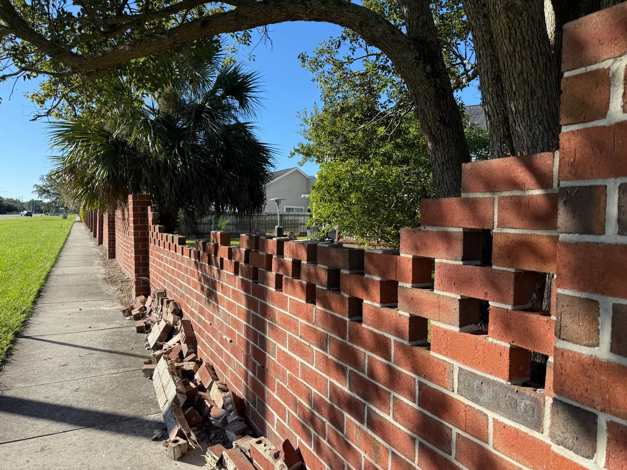 Full wall view showing damage extent
